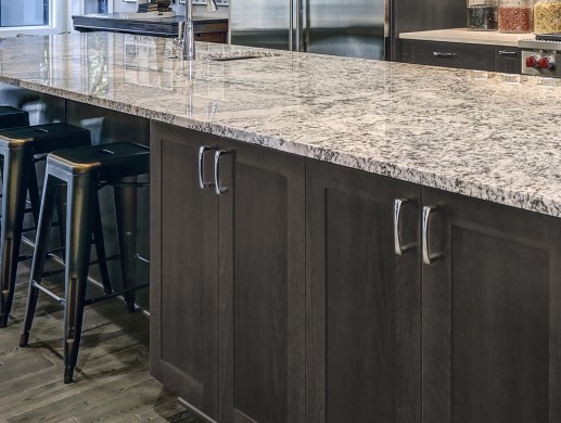 Modern kitchen island with granite countertop, Dark wood kitchen cabinets