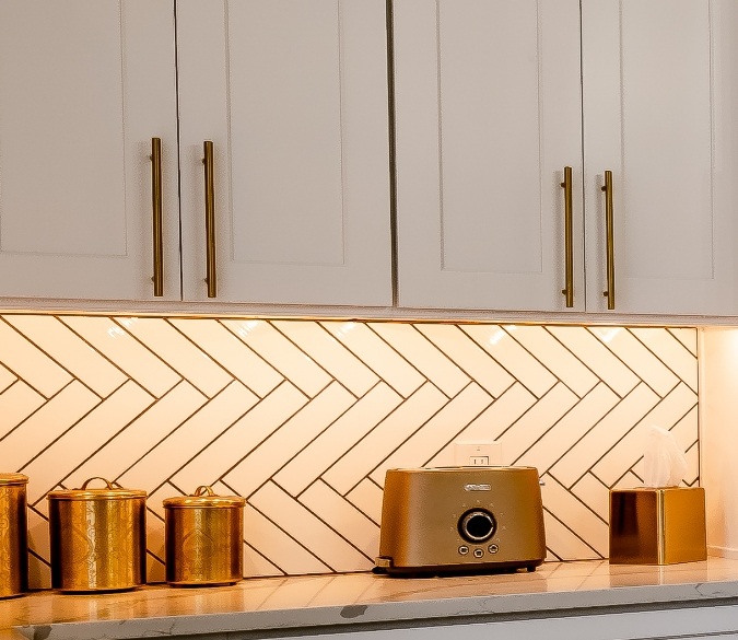 Gold kitchen appliances on counter, modern kitchen decor with gold accents